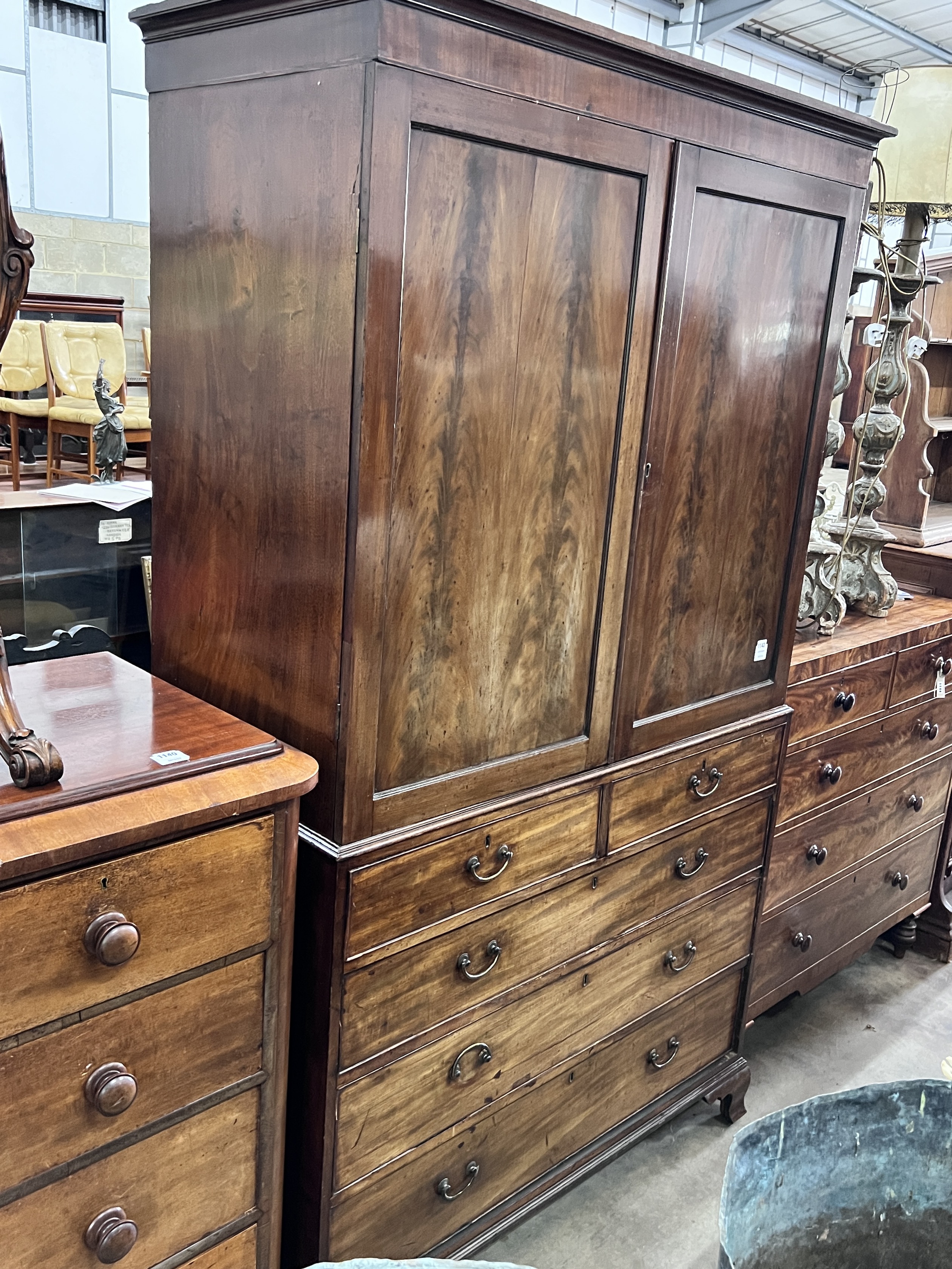 A George III mahogany linen press, width 124cm, depth 57cm, height 215cm